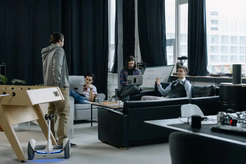 Professionals collaborating in a bright, modern coworking area