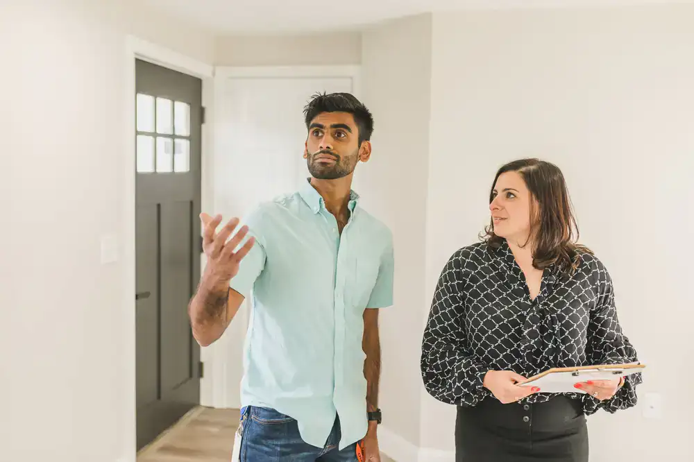 Staff member showing a professional around the space