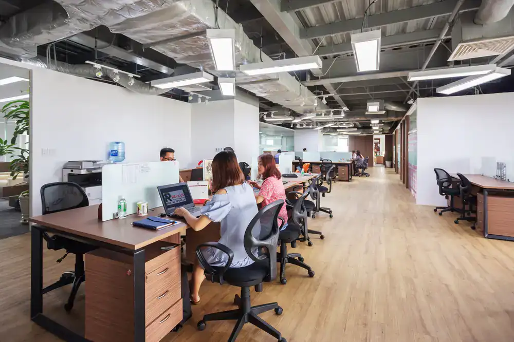 Professional working at a shared hot desk