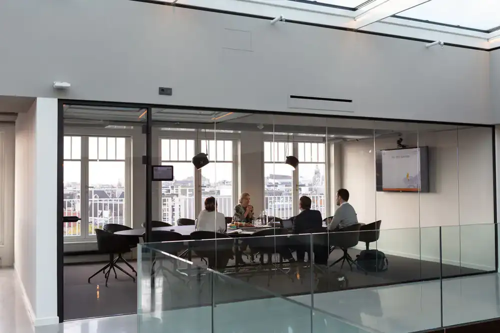 Private glass-walled office for a small team